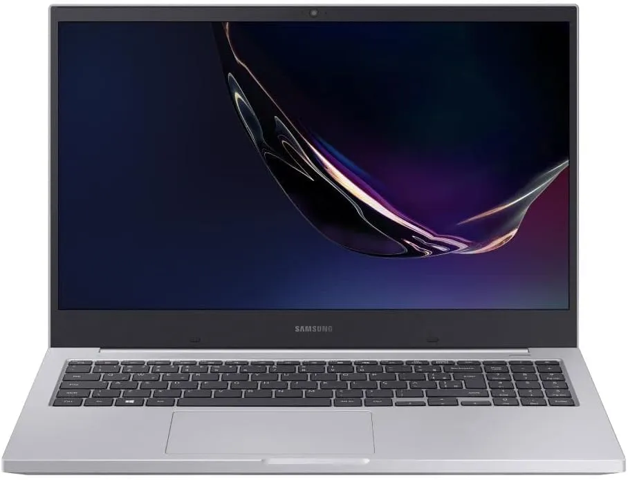 Imagem Do Notebook Samsung Essential De 15,6 Polegadas Na Cor Prata, Com A Tela Ligada Exibindo Gráficos Escuros Abstratos.